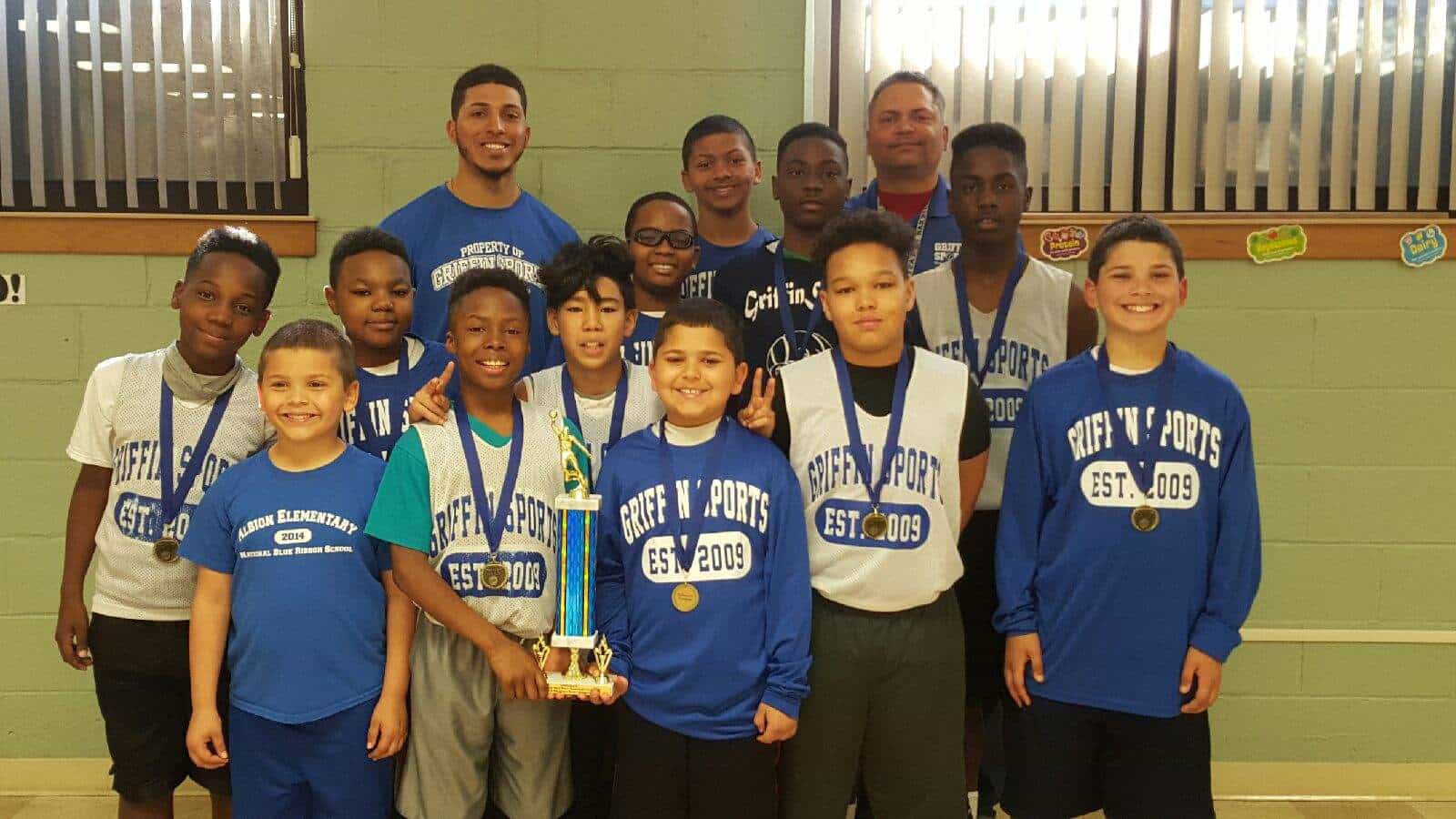 Coaches Clarence Griffin and Clarence Griffin Jr. along with the Champions of the He Is Risen 6th Grade Division. 